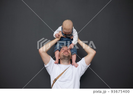 portrait of young father hugging his little daughter 93675400