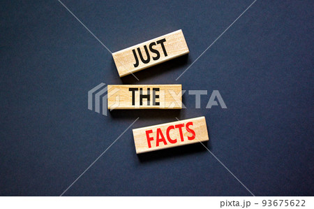 Just the facts symbol. Concept words Just the facts on wooden blocks on a beautiful black table black background. Business and just the facts concept. Copy space. 93675622