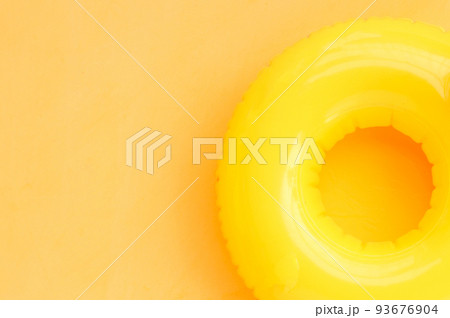 Inflatable ring on yellow background. Summer background concept Inflatable ring on yellow background. Summer background concept 93676904