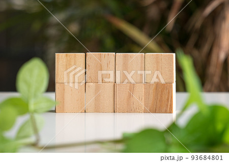 Eight blank wooden block cubes in two rows. Eight blank wooden block cubes in two rows. 93684801