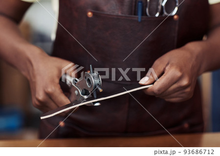 Artisan Creating Leather Belt Artisan Creating Leather Belt 93686712