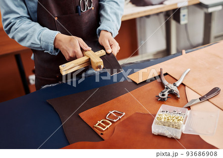 Artisan Measuring Leather Closeup Artisan Measuring Leather Closeup 93686908