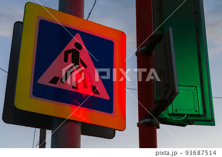 Pedestrian crossing. Road sign with colorful illumination 93687514