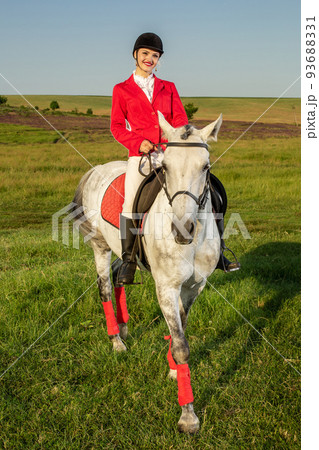 The horsewoman on a red horse. Horse riding. Horse racing. Rider on a horse. 93688331