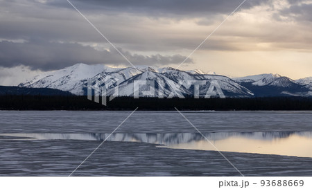 Yellowstone Lake with snow covered mountains in American Landscape 93688669