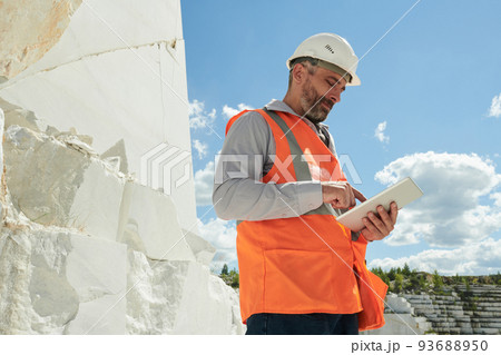 Engineer of modern production factory situated on territory of marble quarry Engineer of modern production factory situated on territory of marble quarry 93688950