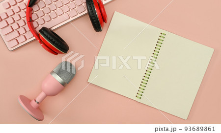 Top view microphone for podcasts, notepad and wireless headphones on pink background Top view microphone for podcasts, notepad and wireless headphones on pink background 93689861