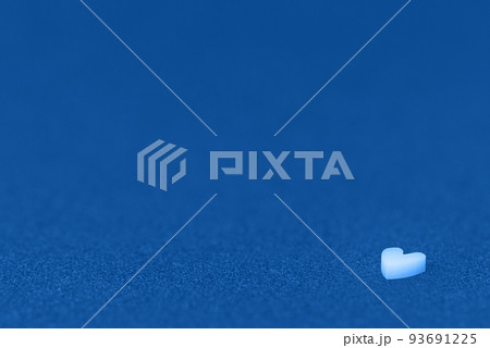 White heart on a blue glittering paper. Love Valentines Day concept. White heart on a blue glittering paper. Love Valentines Day concept. 93691225