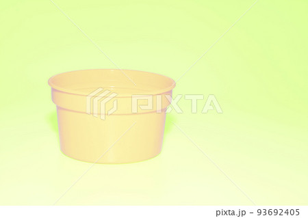 Yellow plastic jar capacity of isolated on salade green pale 93692405