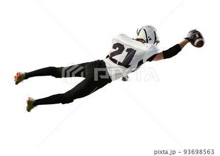 Portrait of american football player in motion, catching ball in a jump isolated over white background. Championship Portrait of american football player in motion, catching ball in a jump isolated over white background. Championship 93698563