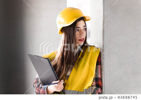 Portrait of a female construction engineer. Portrait of a female construction engineer. 93698745