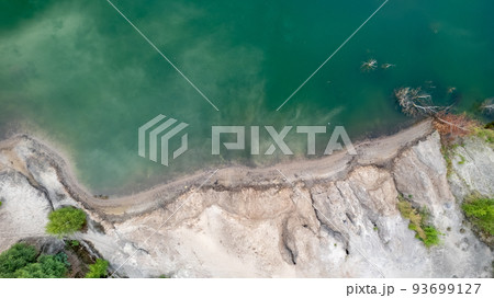 Blue lakes from above. Lakes in green forest in evening sunlight aerial drone view. Scenic summer Blue lakes from above. Lakes in green forest in evening sunlight aerial drone view. Scenic summer 93699127
