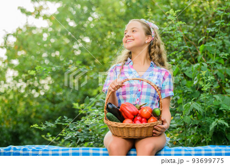 New food. healthy food for children. kid on summer farm. Organic food. little girl vegetable in basket. Only natural. happy little farmer. autumn harvest. harvest vitamin. spring market garden 93699775
