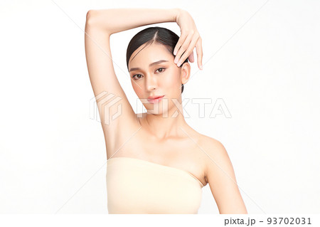 Beautiful Young Asian woman lifting hands up to show off clean and hygienic armpits or underarms on white background, Smooth armpit cleanliness and protection concept Beautiful Young Asian woman lifting hands up to show off clean and hygienic armpits or underarms on white background, Smooth armpit cleanliness and protection concept 93702031