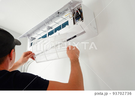 Air conditioner service. The technician checks the operation of the air conditioner. Filter replacement. Cleaning Maintenance of air conditioners Air conditioner service. The technician checks the operation of the air conditioner. Filter replacement. Cleaning Maintenance of air conditioners 93702736