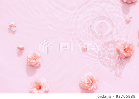 Water beauty background. Natural pattern with pink roses on surface of transparent water close-up Water beauty background. Natural pattern with pink roses on surface of transparent water close-up 93705939