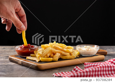 Fried potatoes with ketchup and mayonnaise 93708284