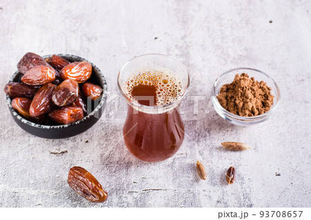 Alternative coffee from ground date seeds on the table. Avoiding caffeine. 93708657