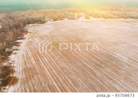 Aerial view autumn field landscape with trails lines. Top view of empty clean field in late autumn day. Drone view bird's eye view. High attitude in autumn season 93708673