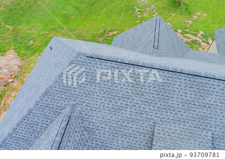 Roofing construction house rooftops covered with asphalt shingles Roofing construction house rooftops covered with asphalt shingles 93709781