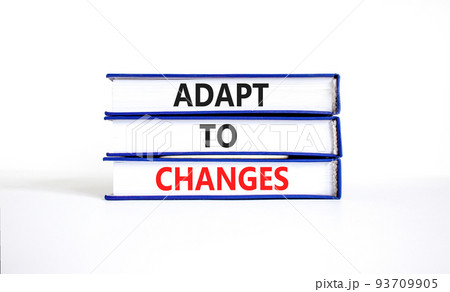 Adapt to changes and support symbol. Concept words Adapt to changes on books. Beautiful white table white background. Business and support Adapt to changes quote concept. Copy space. 93709905
