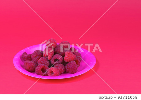 raspberries in pink paper plate fresh organic berries red raspberry fruits 93711058