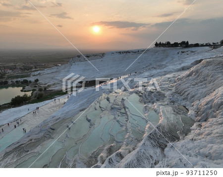Pamukkale Travertines Cinematic Aerial Drone footage. Turkish famous white thermal bath with healthy clean water in a beautiful sunset. Pamukkale Travertines Cinematic Aerial Drone footage. Turkish famous white thermal bath with healthy clean water in a beautiful sunset. 93711250