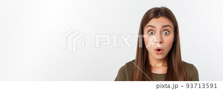 Close-up portrait of surprised beautiful girl holding her head in amazement and open-mouthed. Over white background 93713591