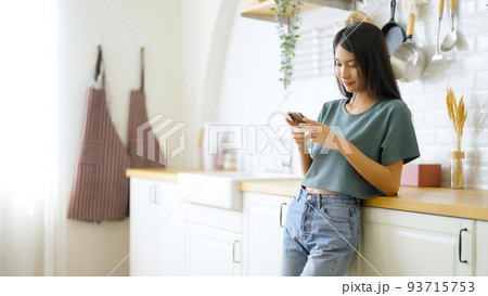 Happy young asian woman relaxing at home 93715753