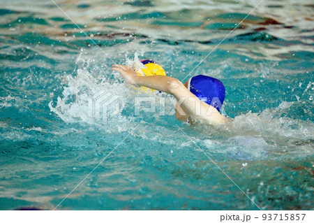 Young men play water polo 93715857