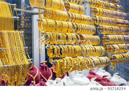 Variety of gold jewelry displayed for sale Variety of gold jewelry displayed for sale 93716254