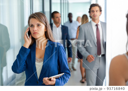 Young businesswoman speaking phone Young businesswoman speaking phone 93716840