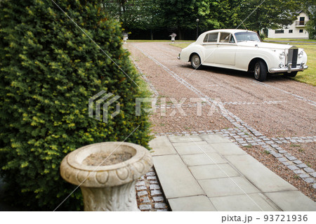Vintage wedding car decorated with flowers. Wedding day Vintage wedding car decorated with flowers. Wedding day 93721936
