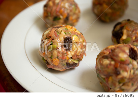 Female hands making dough for mooncake, homemade cantonese moon cake pastry on baking tray before baking for traditional festival. Travel, holiday, food concept Female hands making dough for mooncake, homemade cantonese moon cake pastry on baking tray before baking for traditional festival. Travel, holiday, food concept 93726095