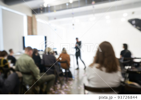 Blurred background of the business conference, one man on the stage, presentation of the project, public talk. High quality photo Blurred background of the business conference, one man on the stage, presentation of the project, public talk. High quality photo 93726844