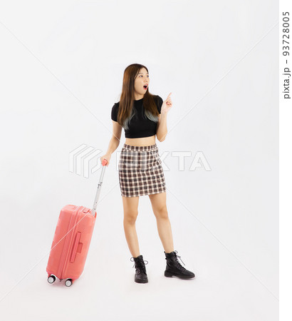 Young asian woman long hair in black crop top t-shirt carrying pink luggage to travelling on white background. 93728005