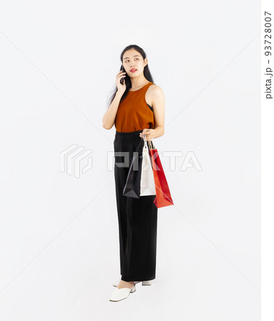 Asian woman calling and shopping on white screen background, full body standing. 93728007