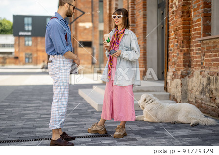 Young hipsters hang out together near office outdoors 93729329