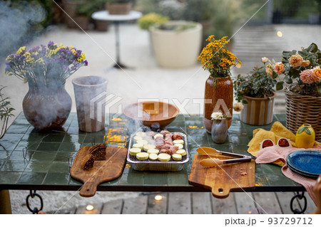 Cooking food on disposable grill at backyard 93729712