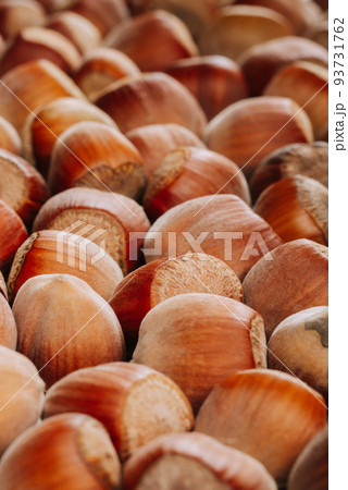 Closeup of some unopened hazelnuts 93731762