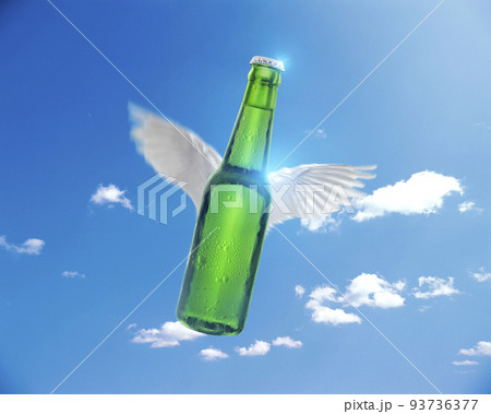 flying Green beer bottle on sun and sky background, sales ideas for advertising flying Green beer bottle on sun and sky background, sales ideas for advertising 93736377