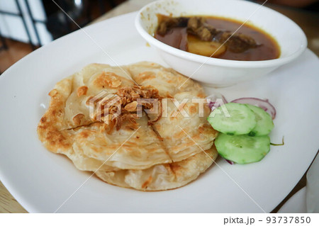 naan bread or roti with curry soup or beef soup naan bread or roti with curry soup or beef soup 93737850