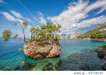 Punta Rata beach with stone island against sunset in Brela, Makarska, Dalmatia, Croatia Punta Rata beach with stone island against sunset in Brela, Makarska, Dalmatia, Croatia 93738187