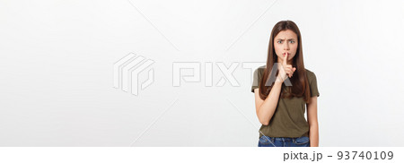 Beautiful woman showing finger over lips isolated on a white background. Beautiful woman showing finger over lips isolated on a white background. 93740109