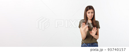 Isolated shot of speechless concerned shocked and angry woman, expressing silence and misconceptions, frightened. Isolated over grey background Isolated shot of speechless concerned shocked and angry woman, expressing silence and misconceptions, frightened. Isolated over grey background 93740157