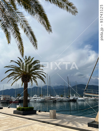 Yachts at the pier against the backdrop of the mountains. Porto, Montenegro 93743125