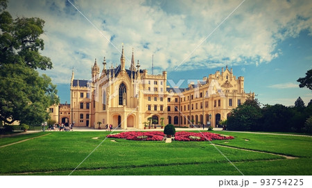 Lednice Chateau with beautiful gardens and parks on sunny summer day. Lednice-Valtice Landscape, South Moravian region. UNESCO World Heritage Site. Beautiful old romantic castle. 93754225