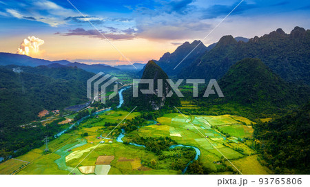 Aerial view of limestone mountains and rice field at sunset in Vang vieng, Laos. 93765806