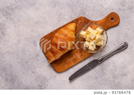 French croissant. Freshly baked croissants with butter 93766478
