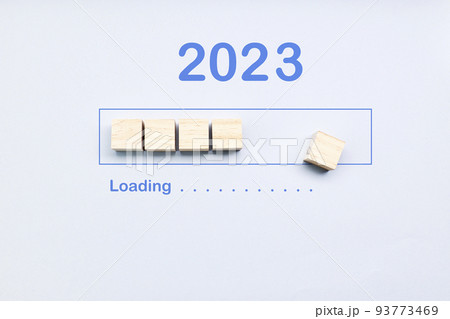 Loading 2023 year on cubes on a blue background. New Year Loading 2023 year on cubes on a blue background. New Year 93773469